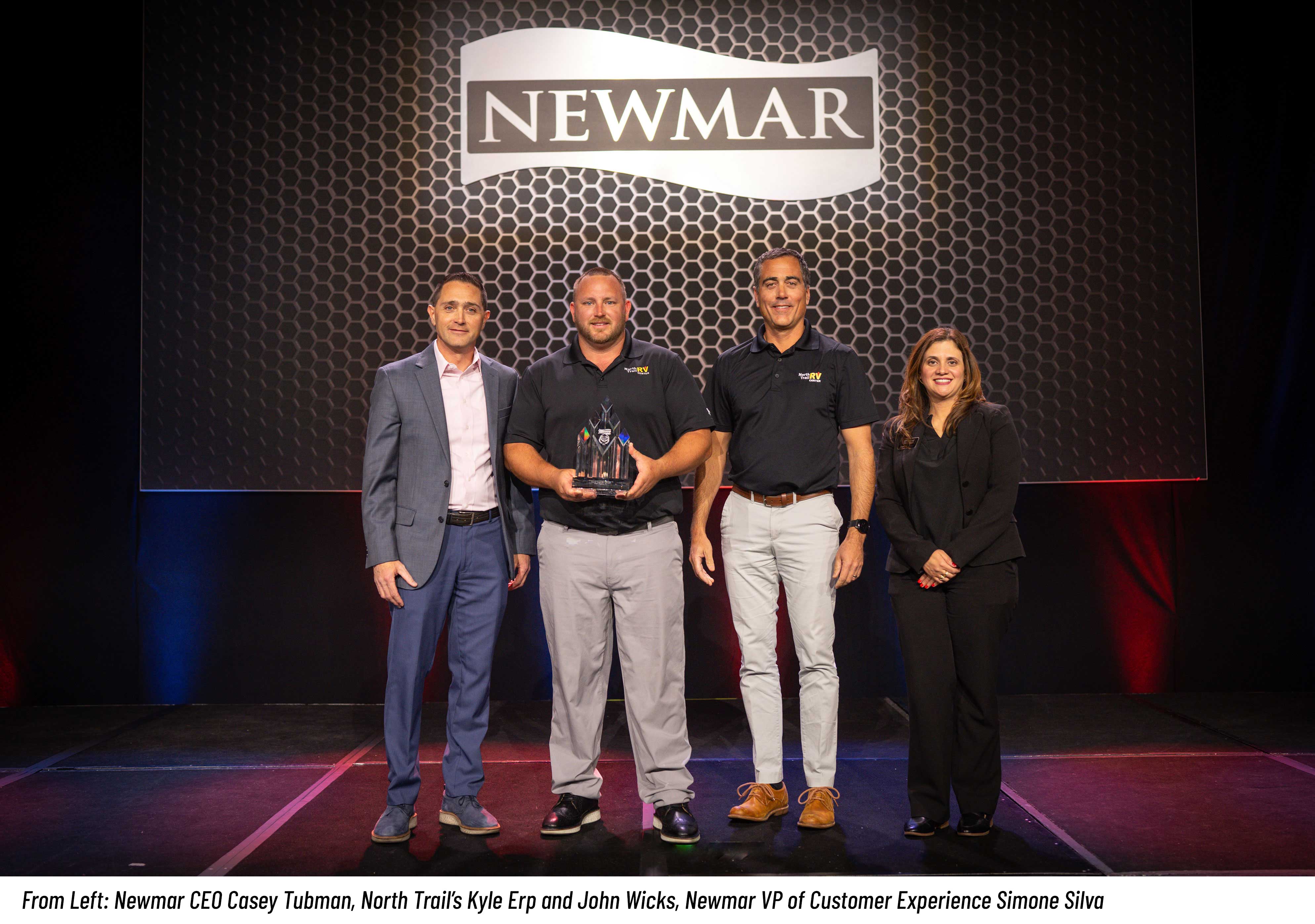 North Trail's Kyle Erp and John Wicks with Newmar CEO Casey Tubman and VP of Customer Experience Simone Silva.