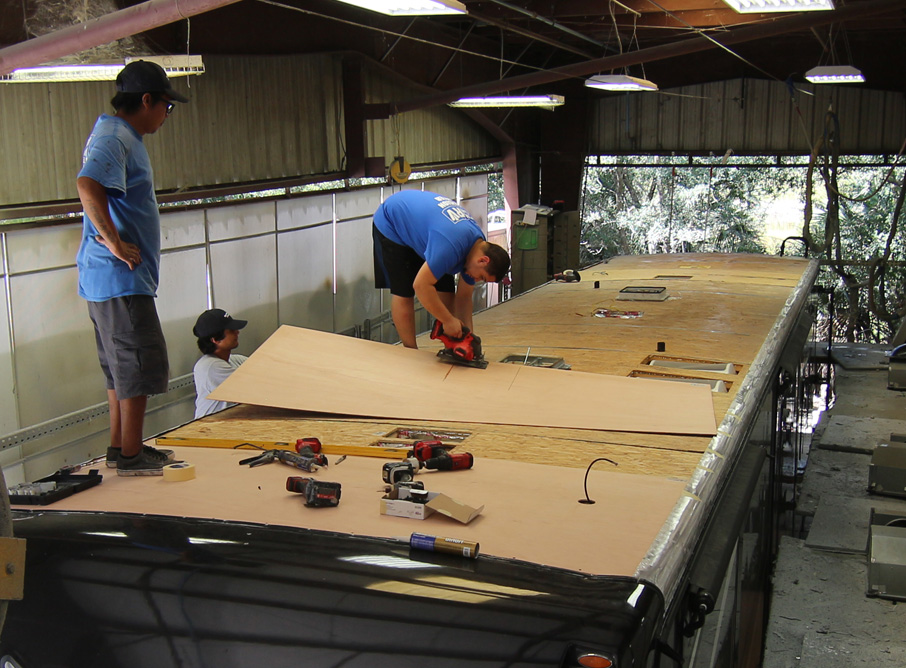 Repairing the roof on an RV.